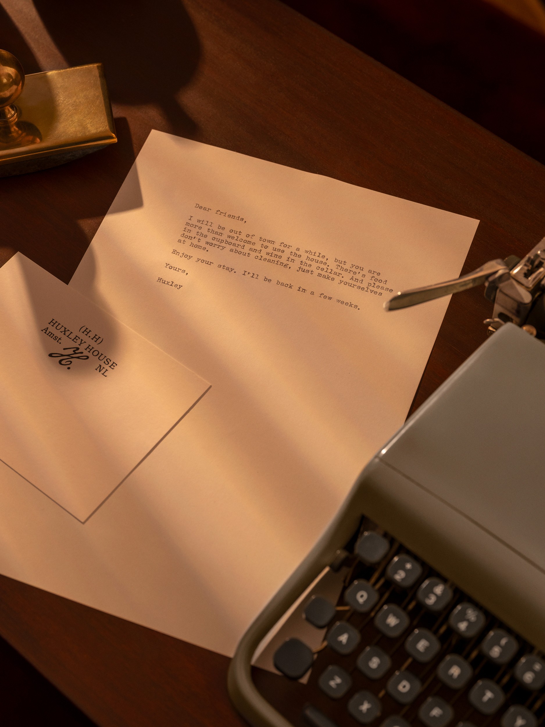 a typewriter next to a letter